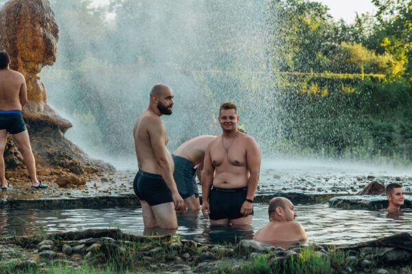 Visitors soaking in a natural hot spring pool