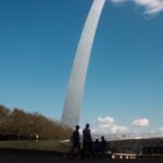 Tourists silhouetted at the Gateway Arch in St. Louis, Missouri