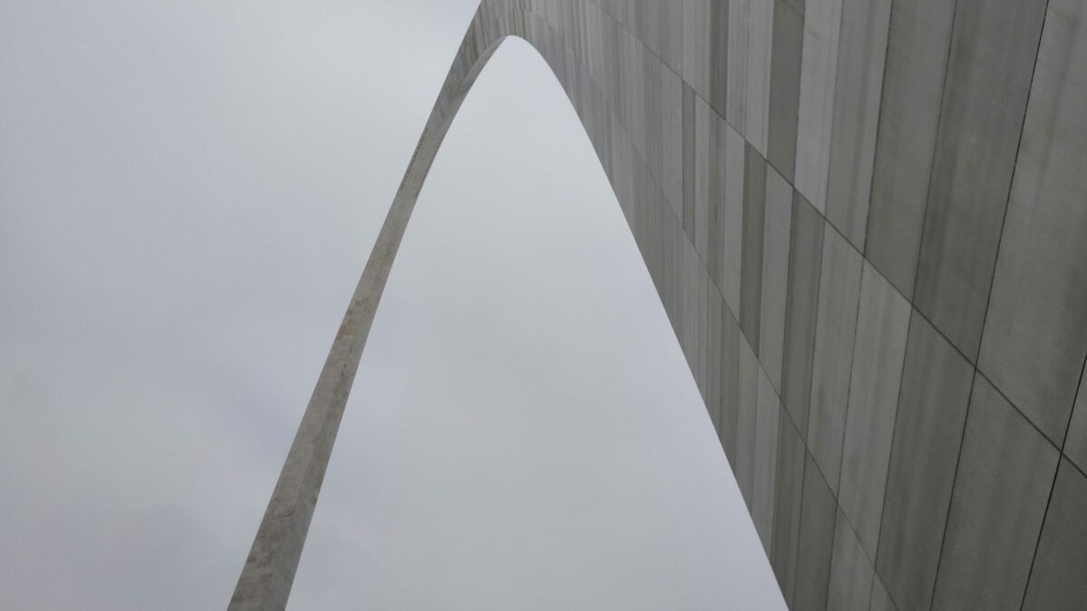 The Gateway Arch in St. Louis rising against the sky, featured image for the 2026 neighborhoods guide
